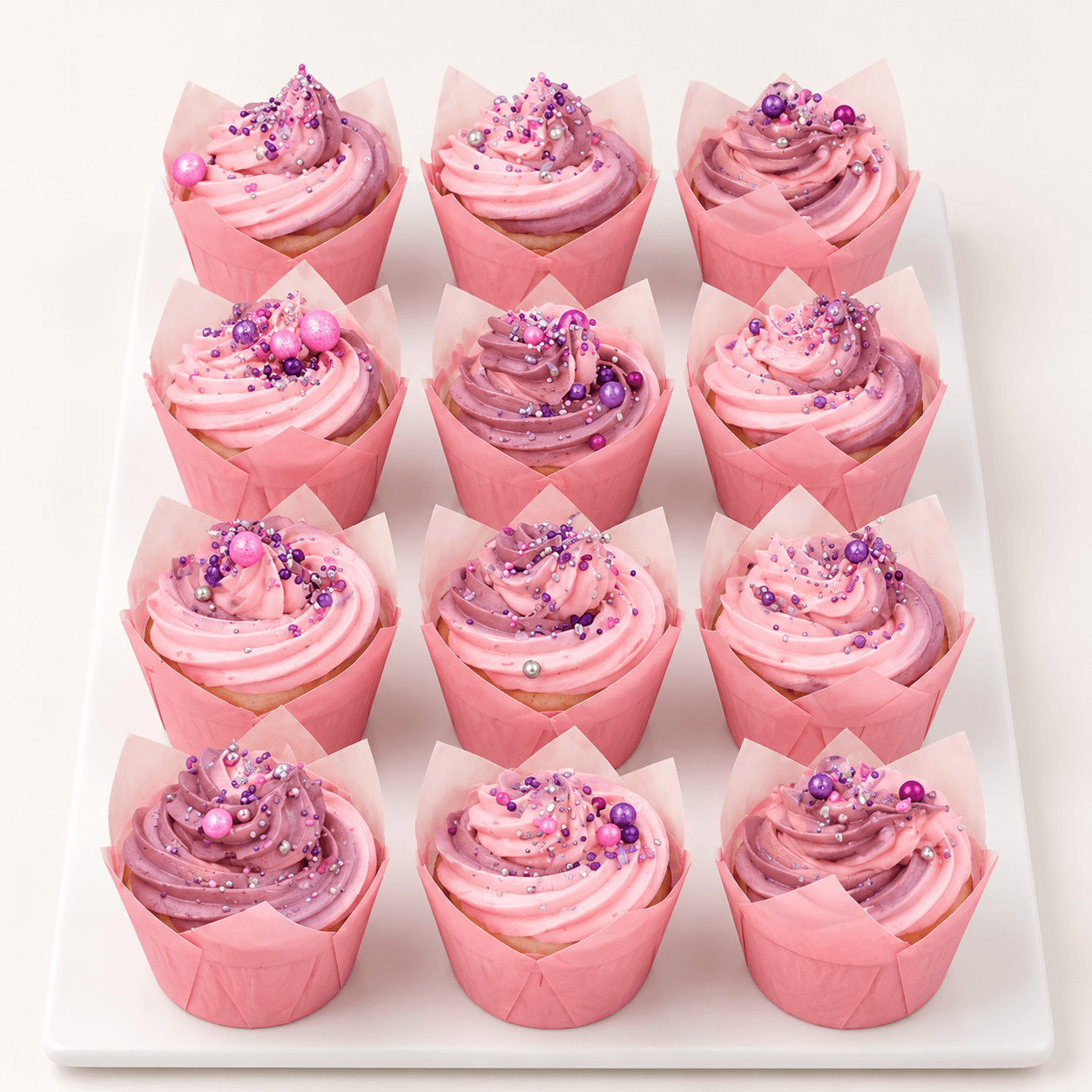 Pink and purple sprinkle cupcakes by Glory Treats