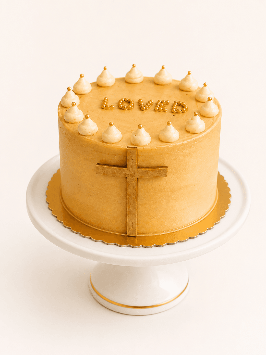 Gold baptism cake with a wooden cross topper and 'Loved' in gold pearls by Glory Treats