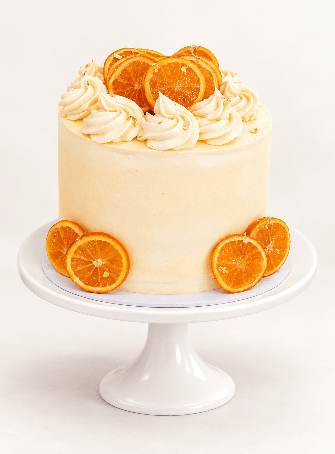 Orange curd cake with orange cream cheese frosting and candied oranges by Glory Treats